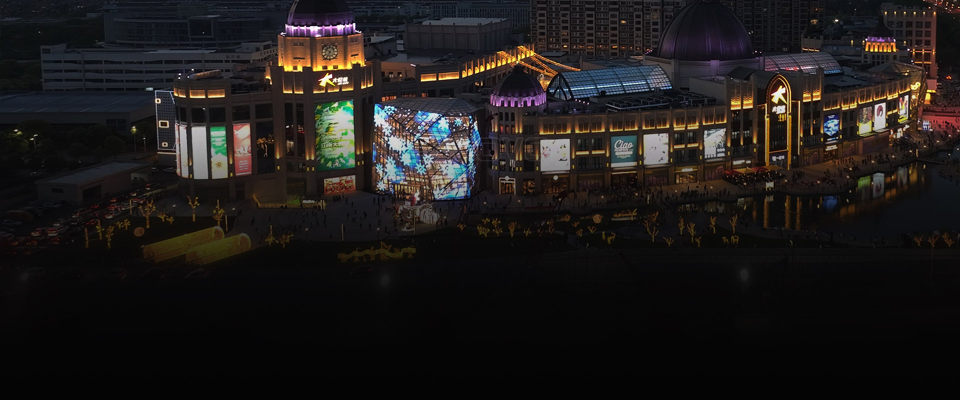 Transparent LED media curtain wall on a multi-story glass building facade