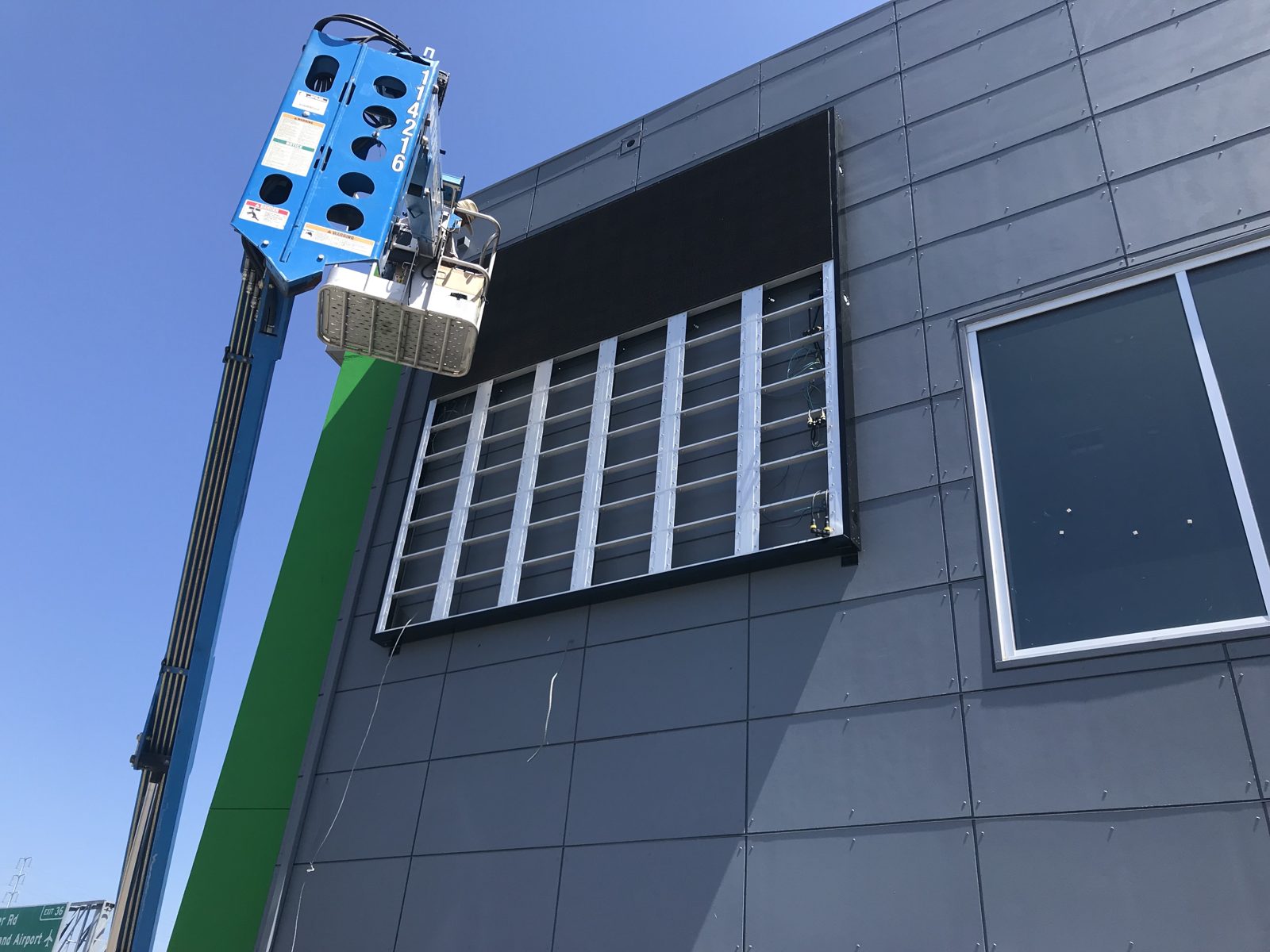Cabinets on green facade